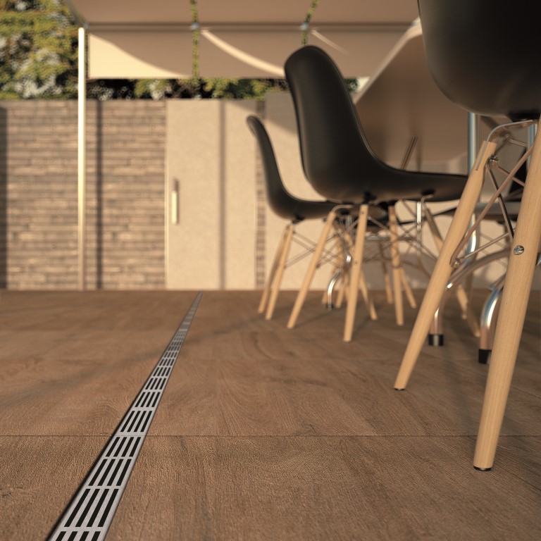 ACO 19000 integrated seamlessly with patio tiles.